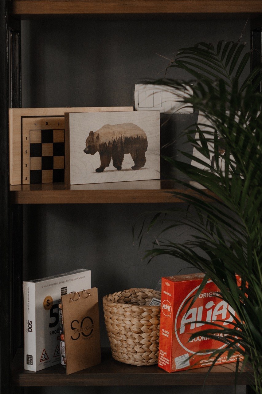 Shelf of board games at Smoky Ocean hookah lounge